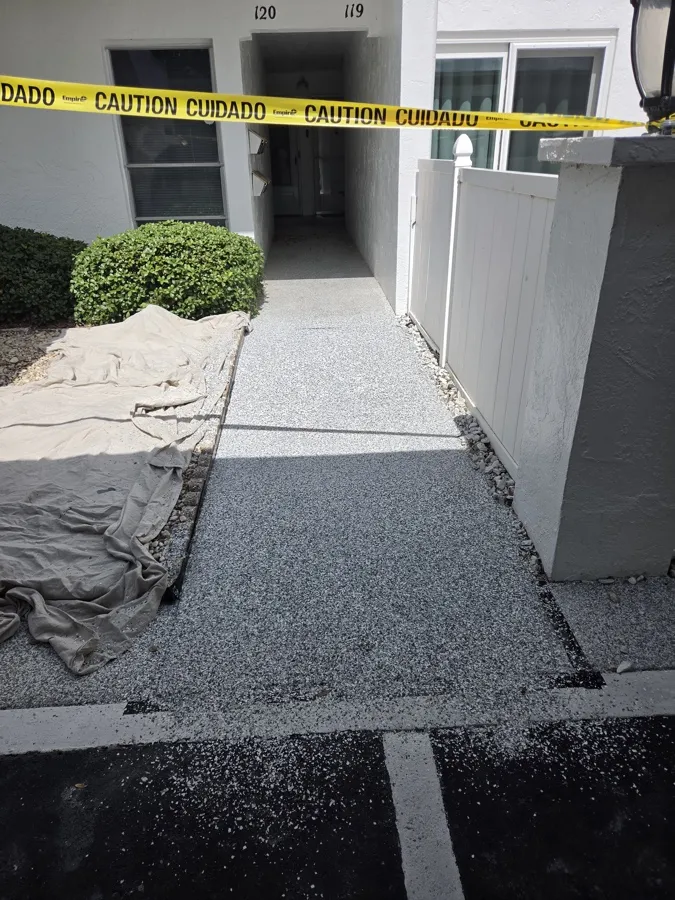 Completed flake system walkway between residential buildings in Tampa Bay